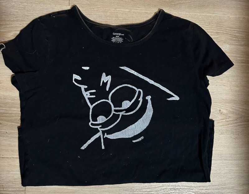 Black tee with bold graphic bleach art