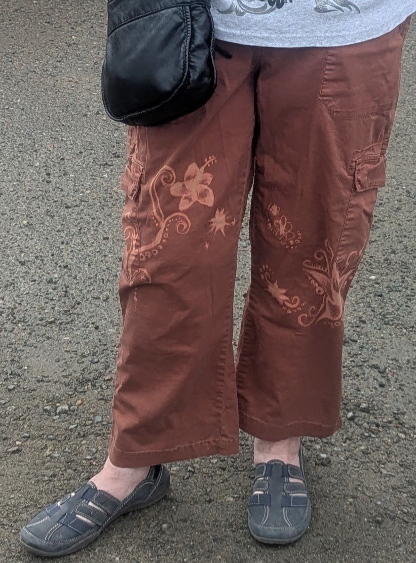 Brown pants with floral bleach art designs